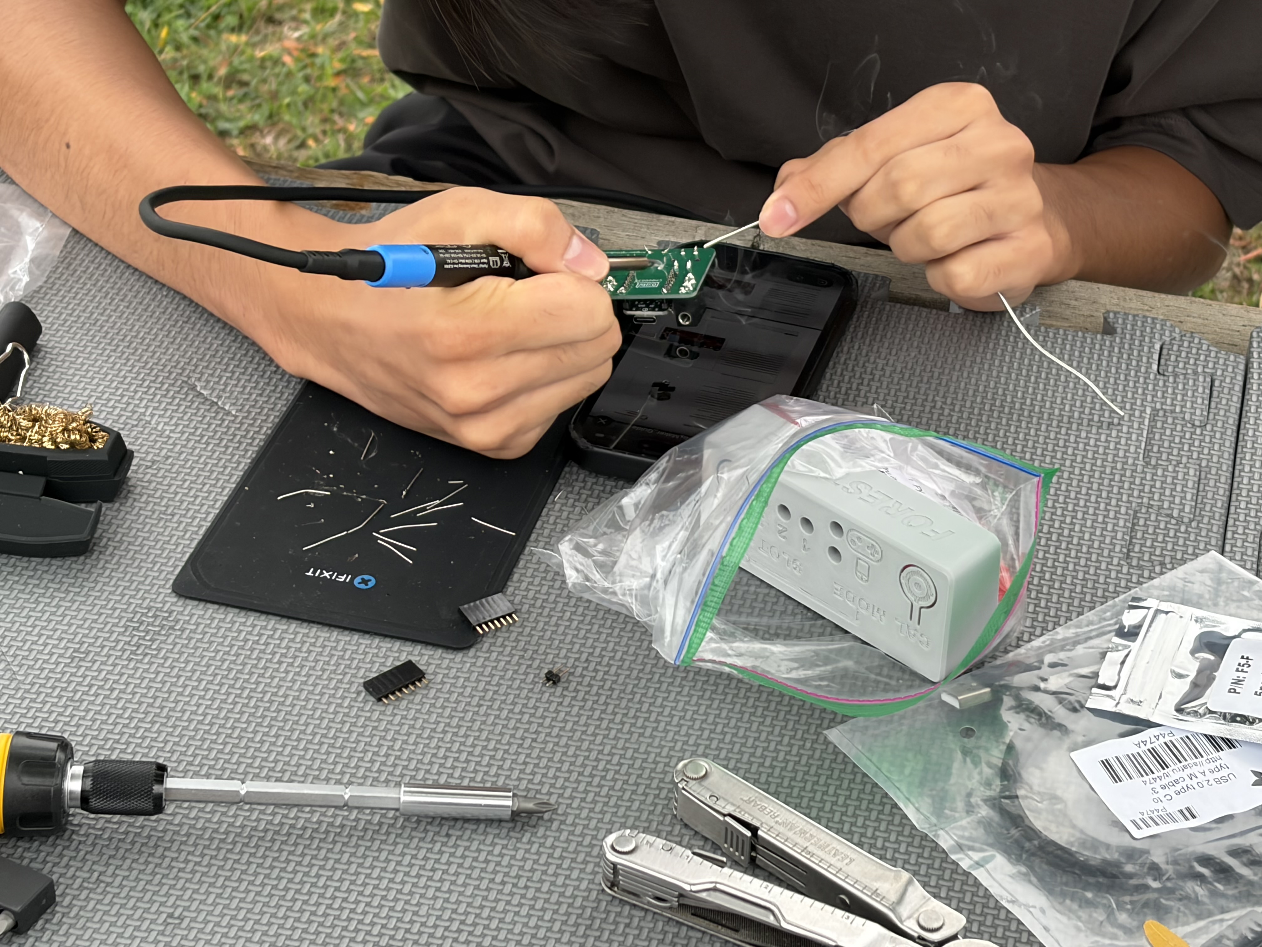 Student assembling a device